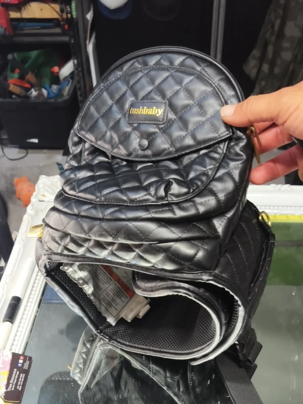 a MINT Tushbaby Quilted Vegan Black Leather Bag. Excellent.